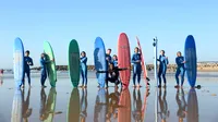 Surfers with boards